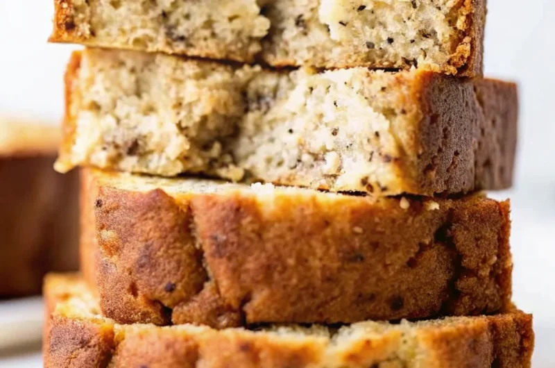 Easy banana bread recipe sliced thick showing moist texture with visible nuts and chocolate chips